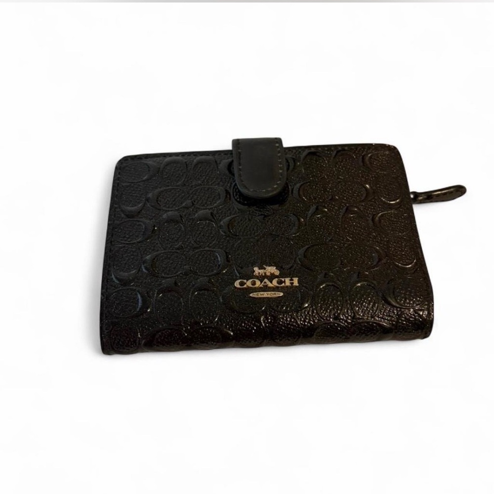 Coach black wallet with embossed logo
